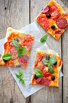 Pizza with tomatoes, cheese and salami