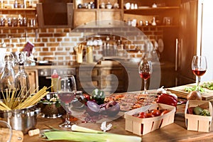 Pizza, wine and vegetables ready for party