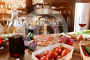 Pizza, wine and vegetables ready for party
