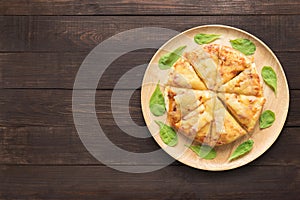 Pizza on wooden background. Copy space for your text