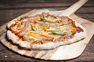 Pizza on wooden tray