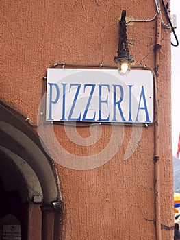 Pizzeria restaurant sign on old building in Vernazza Cinque Terre Italy