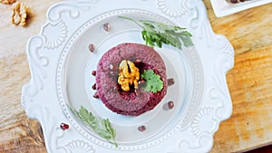 Pkhali traditional Georgian food. Beetroot is used for the purple color. Walnut is used for decoration