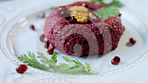 Pkhali traditional Georgian food. Beetroot is used for the purple color. Walnut is used for decoration