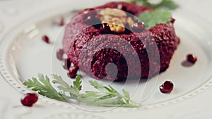 Pkhali traditional Georgian food. Beetroot is used for the purple color. Walnut is used for decoration, lens distortion