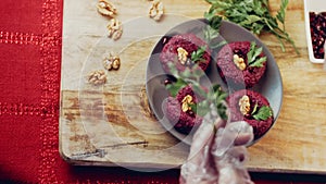 Pkhali traditional Georgian food. Beetroot is used for the purple color. Walnut is used for decoration, lens distortion