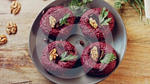 Pkhali traditional Georgian food. Beetroot is used for the purple color. Walnut is used for decoration, lens distortion