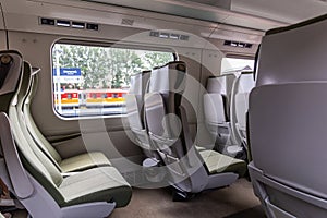 PKP Express InterCity train, railway wagon without compartments inside view, Poland.