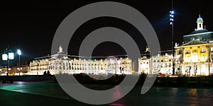 Place de la Bourse of Bordeaux city at night with water mirror front