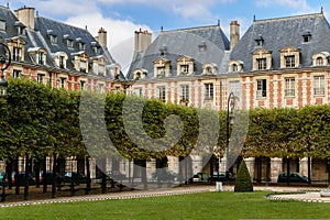 Place des Vosges: square in Le Marais, Paris, Fran photo