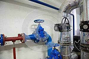 Place in a large industrial boiler room.