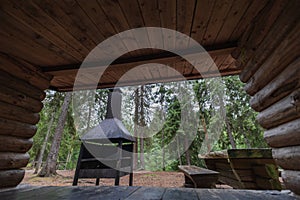 Place for outdoor recreation in Estonia in the forest, camping place, barbecue, wooden table and benches