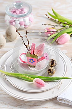 Place setting for Easter table with spring flowers