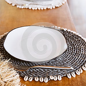 Place setting with sea details creatively placed on the home or restaurant table. Modern design beach bar hipster