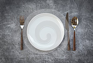 Place setting table food with set of white plate on table cloths or napkin on the dinner / empty plate spoon fork and knife on