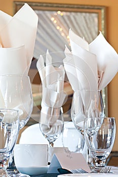 Place setting with wine glasses and place card