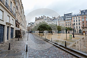 Place Square Dauphine Paris, France under the rain