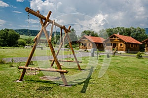 A place to relax and unwind with swings area, benches and trees around