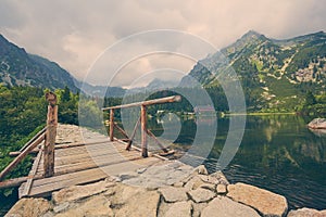 A place for walking and hiking is high. High altitude lake near steep mountains. Popradske pleso, Slovakia, Europe