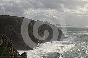 Place where the sea meets the land. High cliffs. Big waves and gusty winds. Cabo da Roca - rainy day.