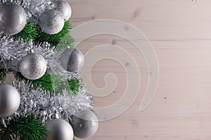 Place for your text, beautiful background with a decorated Christmas tree decorated with silver balls, copy space.