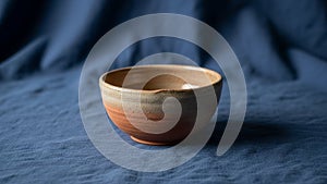 Is placed on a blue fabric surface adding contrast to the natural tones of