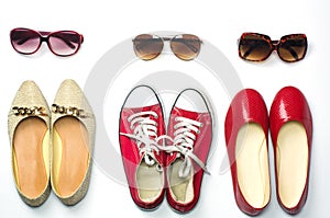 Placed shoes and sunglasses on a white background styles - lifestyles.