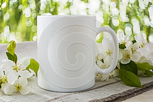 Placeit-Mug mockup with spring apple blossom