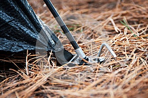 Placement of tent â€“ peg and hoop