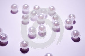 Placer beads. White beads. White artificial pearl beads. Imitation pearls. A pearl mound. photo