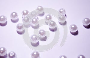 Placer beads. White beads. White artificial pearl beads. Imitation pearls. A pearl mound. photo