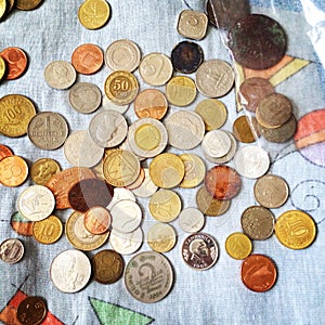 Placer of coins of different countries photo