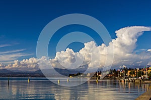 A placid lake reflecting clouds, Lake Garda