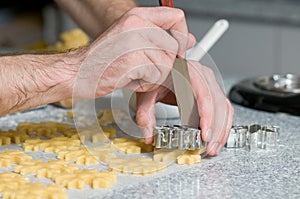 Placing cookies after cutting on backing paper photo