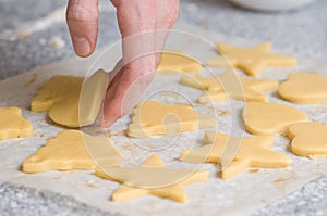 Placing cookies after cutting on backing paper