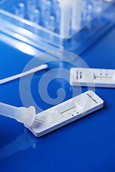 Placing sample into a covid-19 rapid antigen test