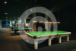 Placing snooker balls on a green billiard table