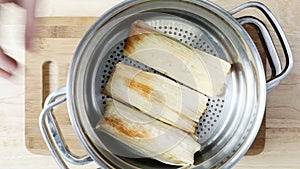 Placing Tamales in a Steamer