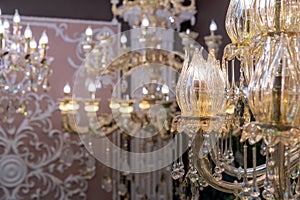 Plafond in the form of a blossoming flower bud on a crystal chandelier with pendants