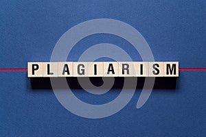 Plagiarism word concept on cubes