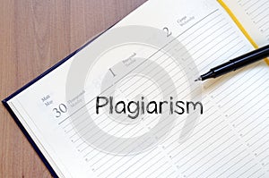 Plagiarism write on notebook photo