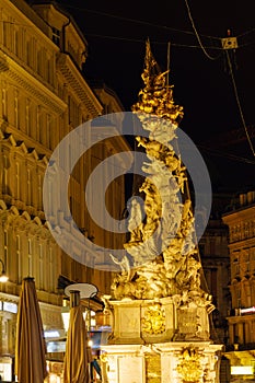 The Plague Column on Graben street 1679 at night, Vienna, Aust photo