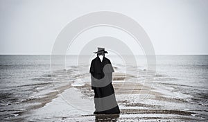 Plague doctor in seaside.