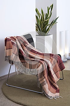 Plaid draped over a chair