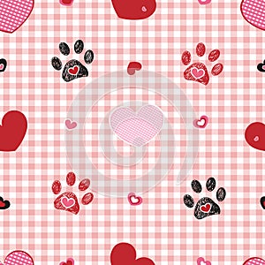 Plaid pattern baby pink with Valentine`s Day concept. Paw print with heart seamless fabric design