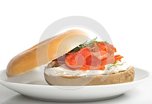 Plain bagel with cream cheese, salmon and dill