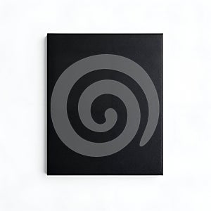 Plain black rectangular object with textured surface on white background rectangle