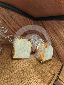 plain bread in packages ready to be taken by consumers