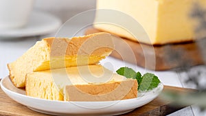 Plain classic Taiwanese traditional sponge cake Taiwanese castella kasutera on a wooden tray background table with ingredients,