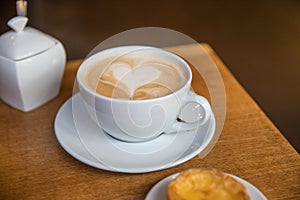 Plain cup of coffee with a heart